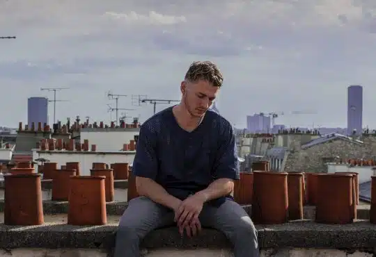 man sitting on roof deck