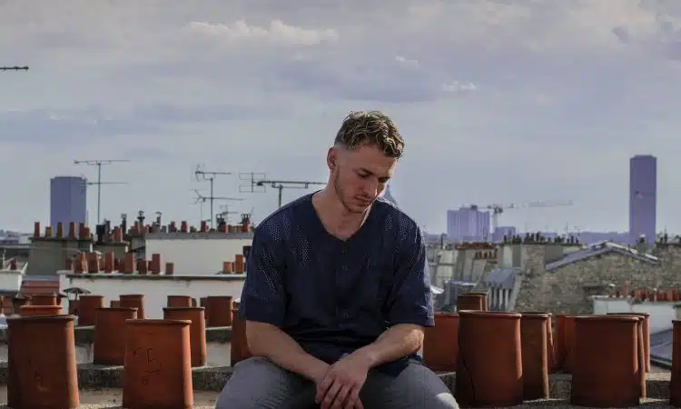 man sitting on roof deck